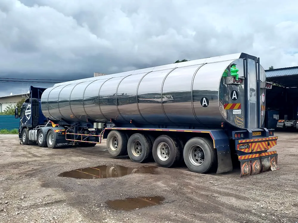 Stainless tri-axle tanker trailer at the depot