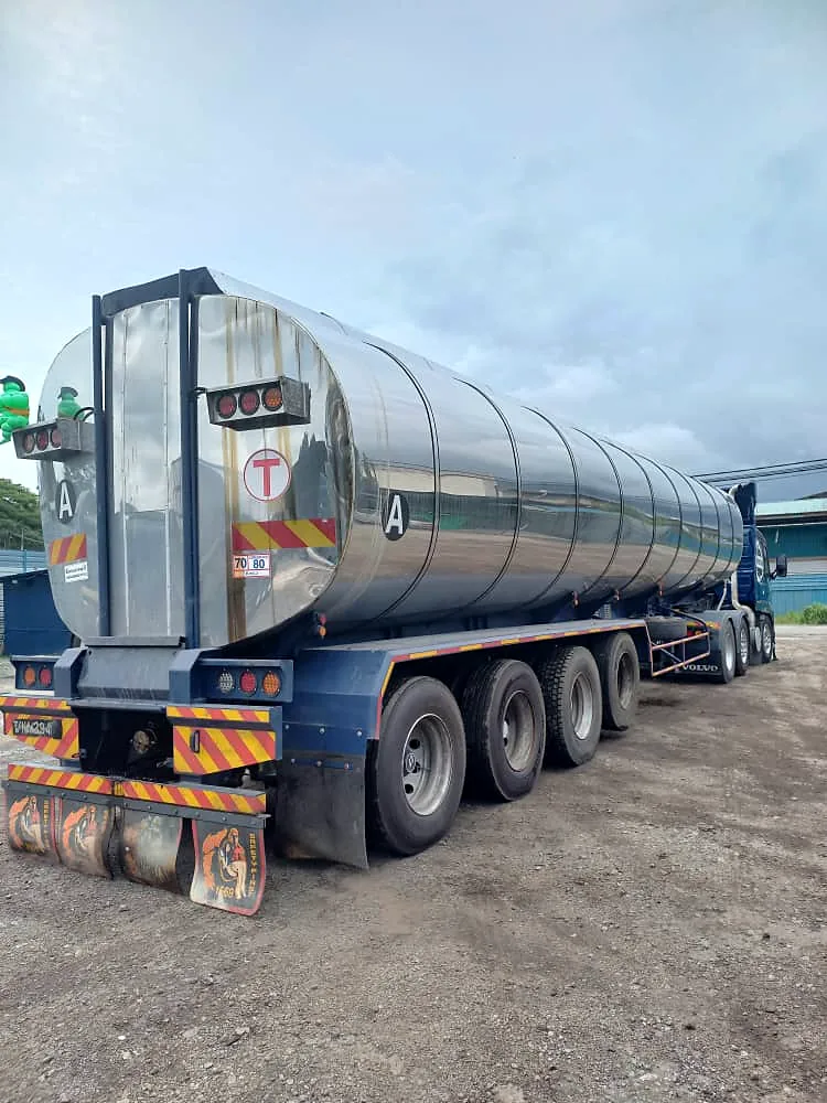 Rear of a stainless-steel tanker with safety markings