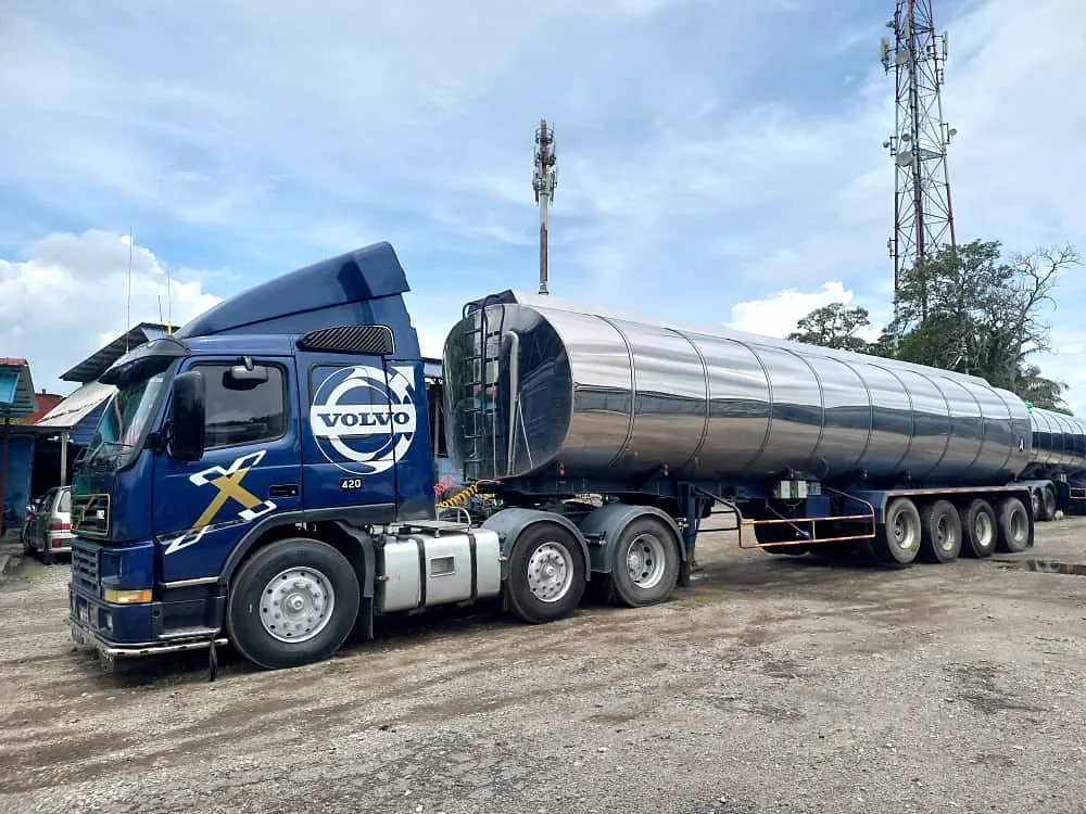 Blue Volvo FH prime mover with a polished stainless-steel tanker