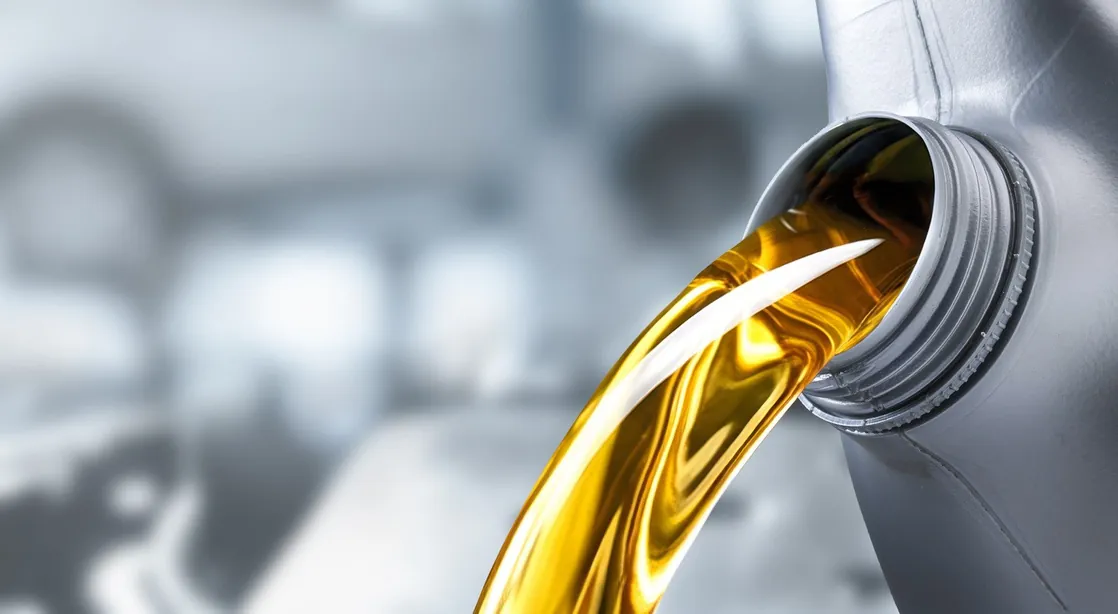Golden fuel oil pouring from a container