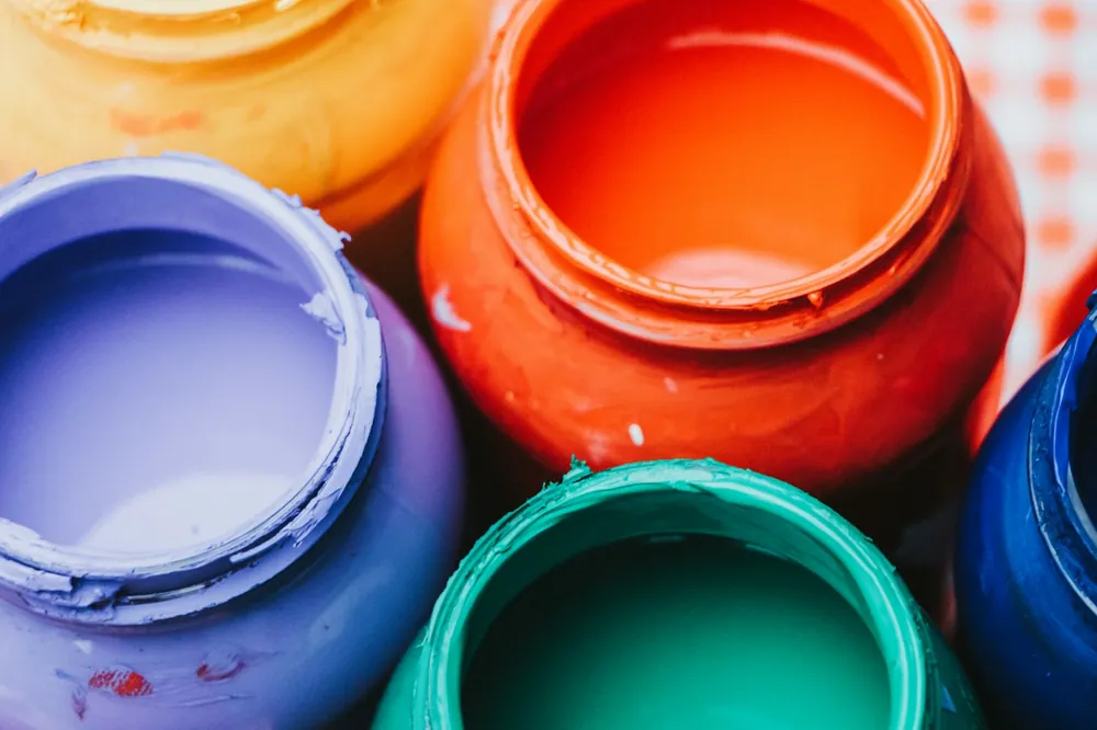 Open cans of industrial paint